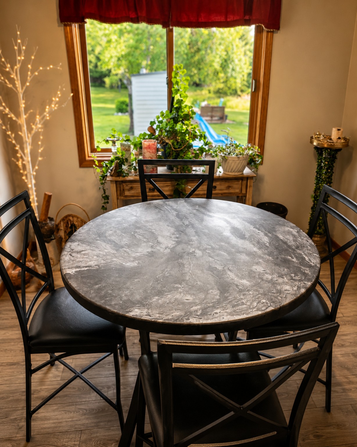 Round custom gray marbled epoxy dining table